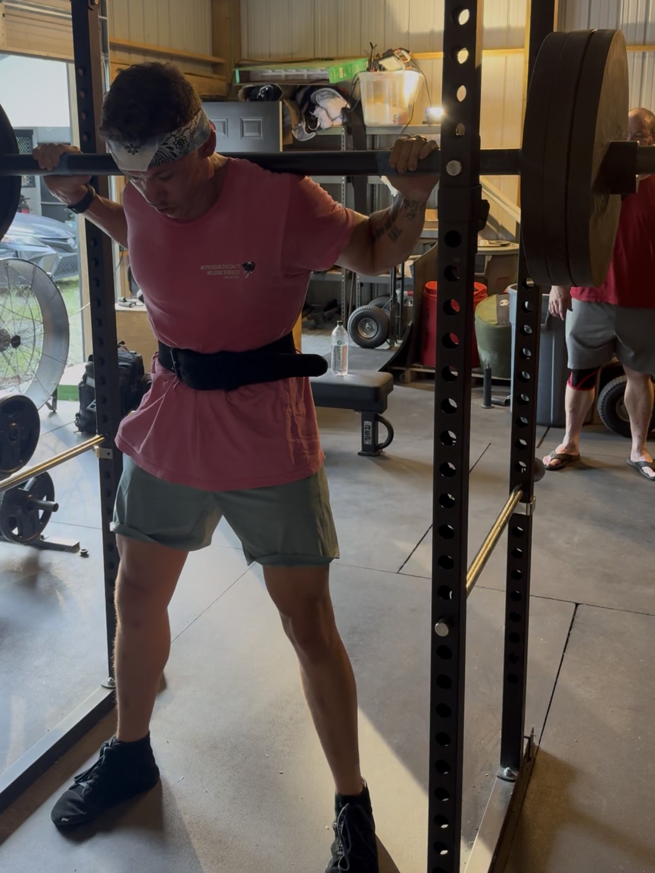 Ronnie McPherson at the bottom of a heavy squat, training for Strongman Nationals